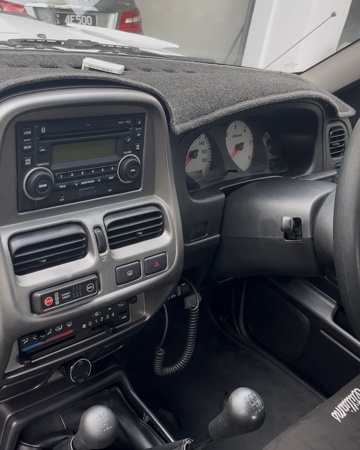 A ute dashboard after a detail, every surface wiped down